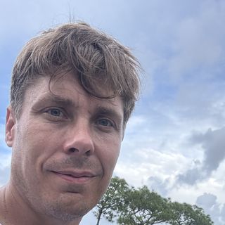 Selfie of Paul Trapp, the exclusion specialist who built this guide, outdoors under a cloudy sky.