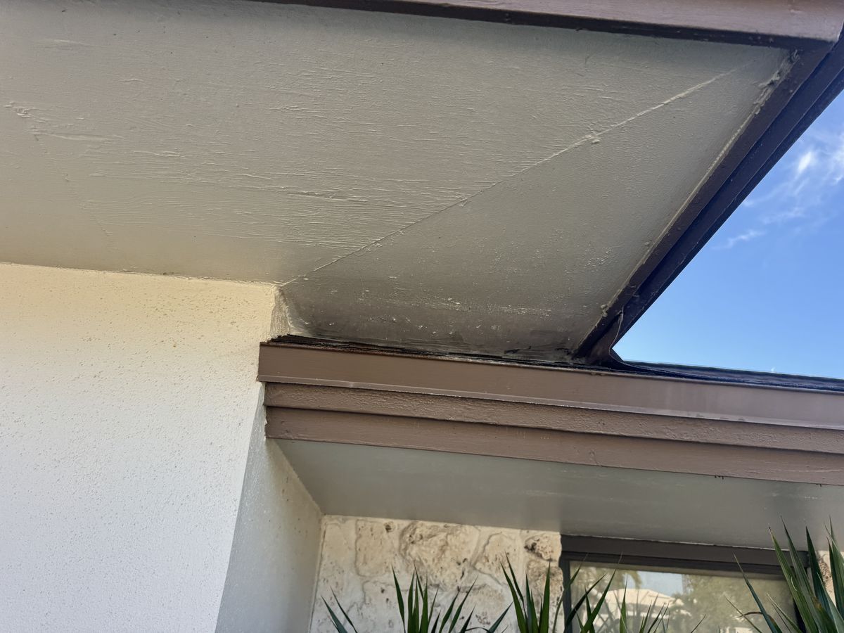 The same stepped fascia corner after sealing: the corner is closed.
